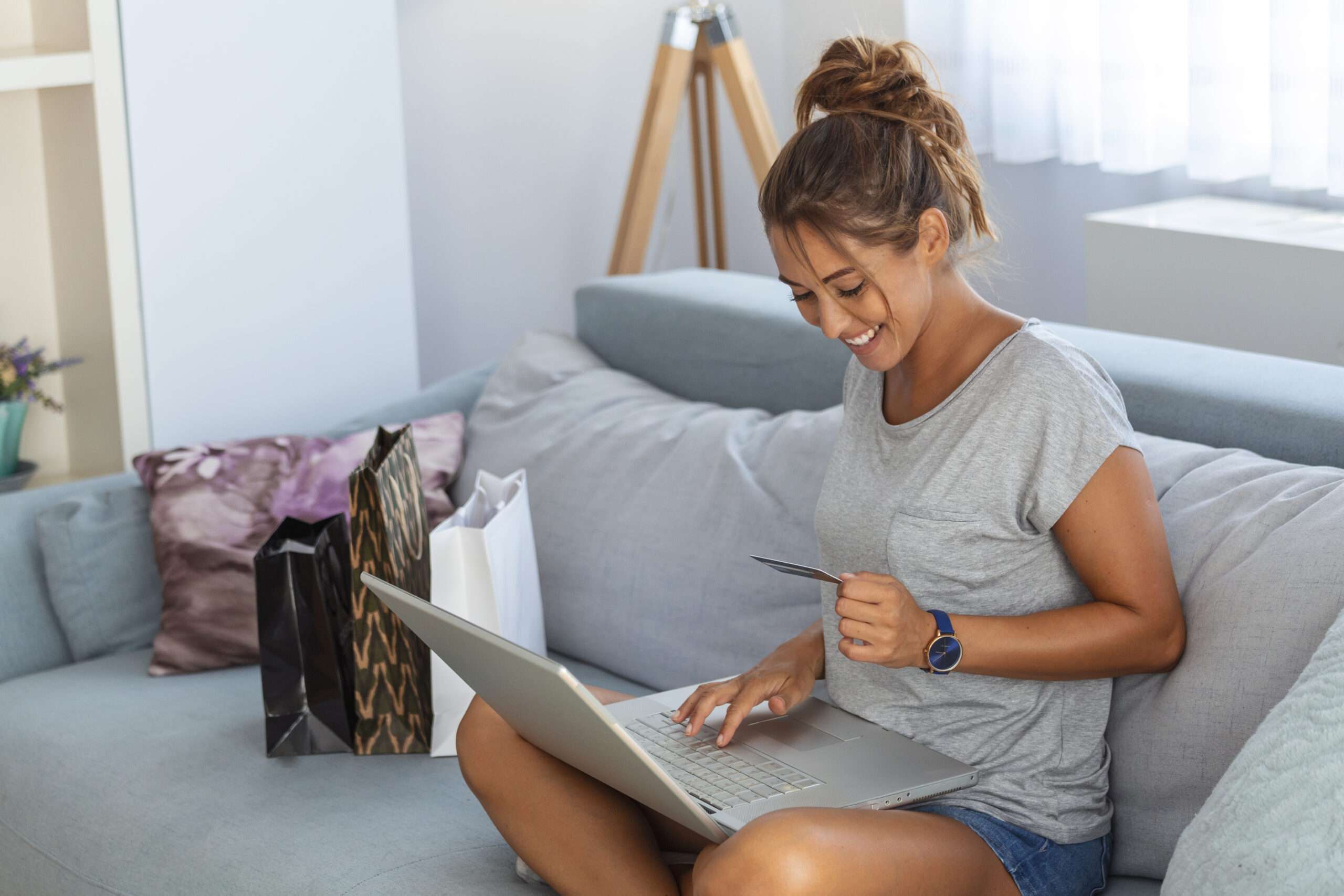 Picture showing pretty woman shopping online with credit card woman holding credit card and using laptop Online shopping