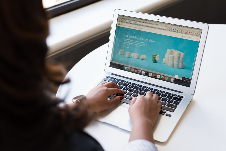 A person building an online store on a laptop