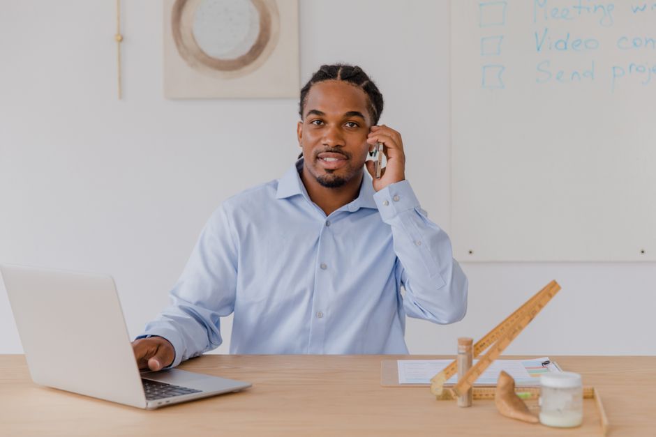 A small business owner using AI automation to save time at work