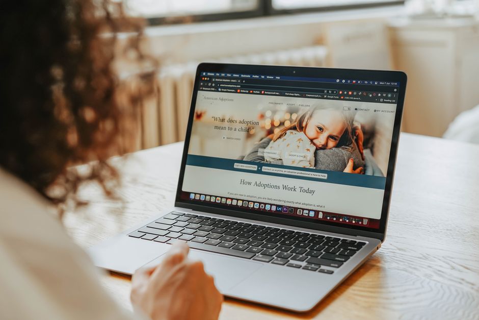 A visitor viewing a business homepage on screen