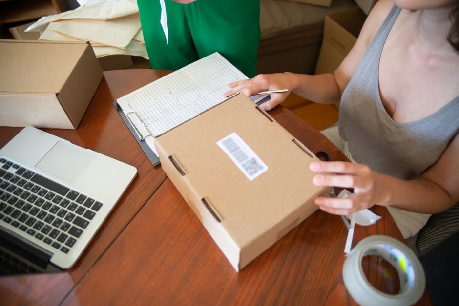 A small business packing orders placed through a social shopping platform