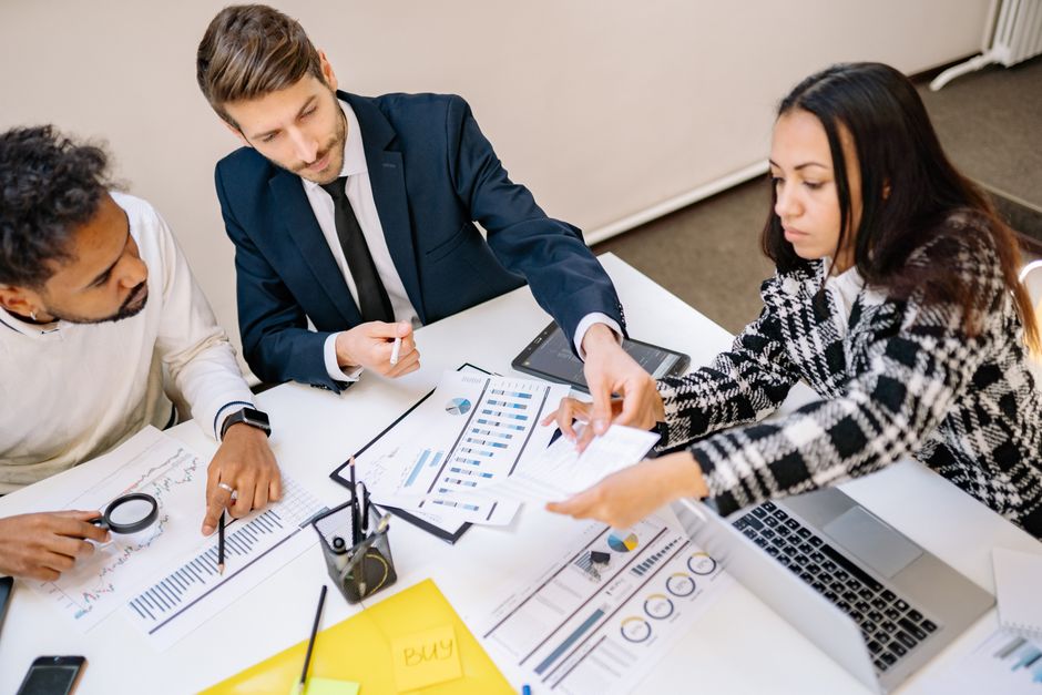 Business owner discussing a website performance review with a consultant