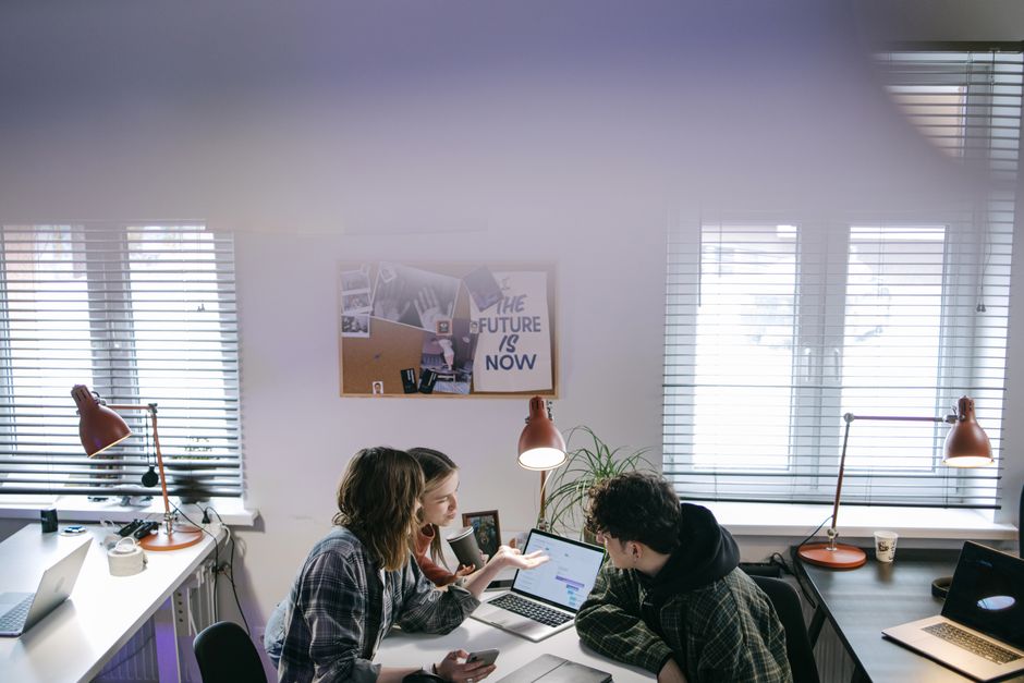 Marketing team reviewing website speed results together