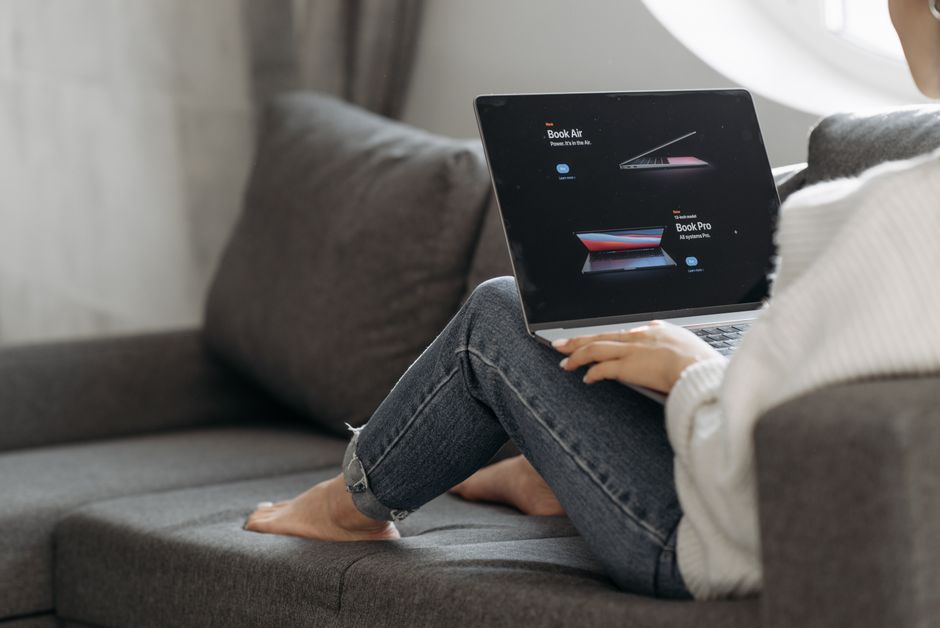 Small business owner reviewing website performance on a laptop