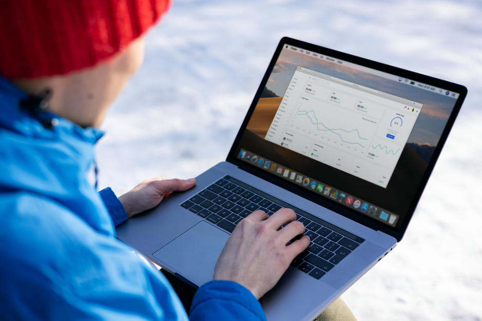 Business owner reviewing video performance analytics on a laptop