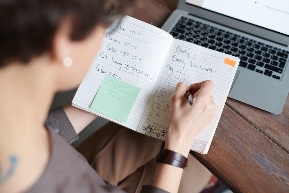 Business owner writing down questions about conversion tracking
