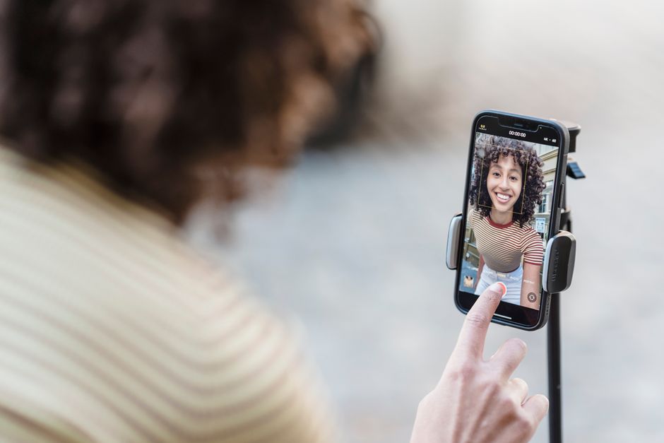 Customer watching a short vertical video on a smartphone