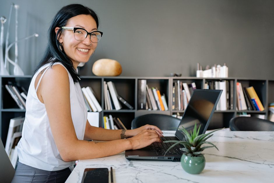 Small business owner checking their website on a laptop