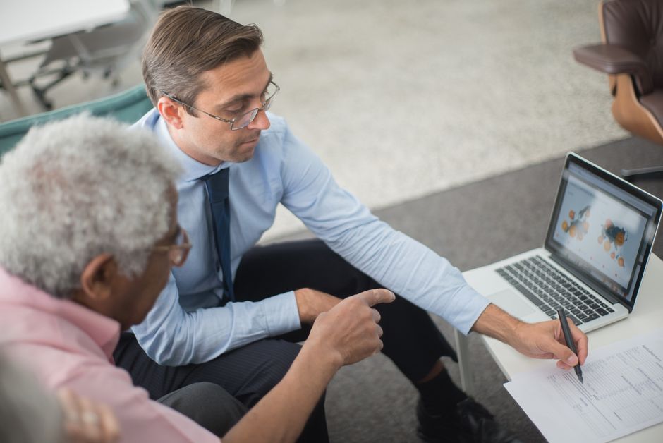 Two colleagues auditing advertising conversion data together