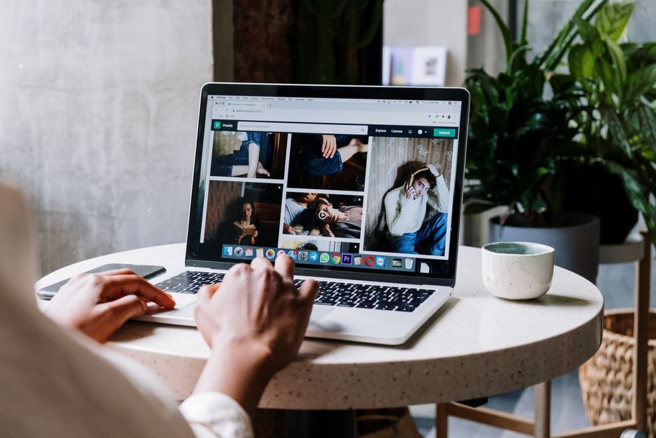 Web designer reviewing an accessible website layout on a laptop
