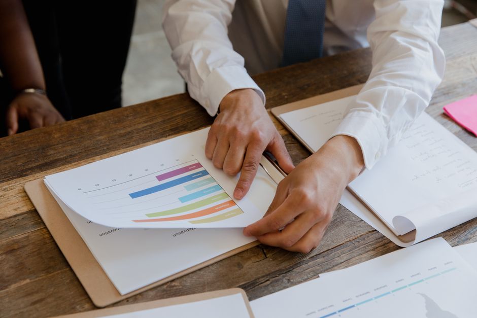 Business owner and agency team agreeing next steps from an SEO report