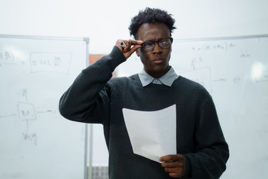 Business owner puzzling over a confusing SEO report full of jargon