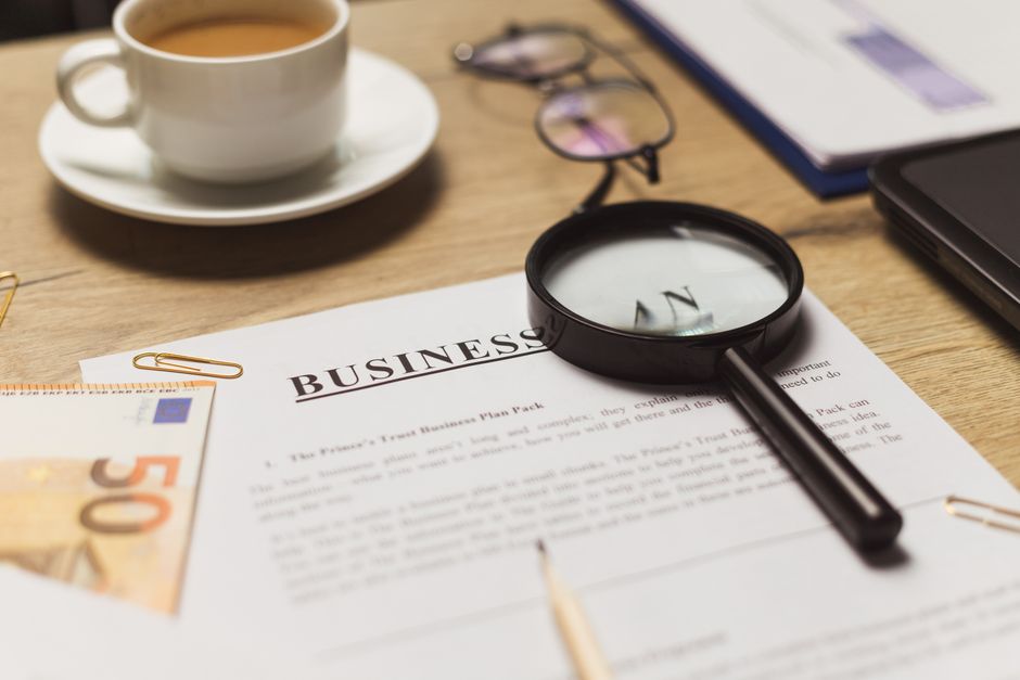 Magnifying glass examining an SEO report for misleading metrics