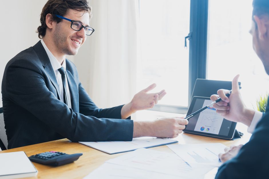 Reviewing monthly SEO report results on a tablet