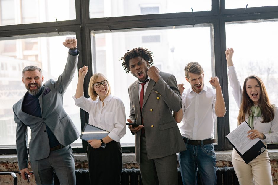 Small business team celebrating improved email marketing results
