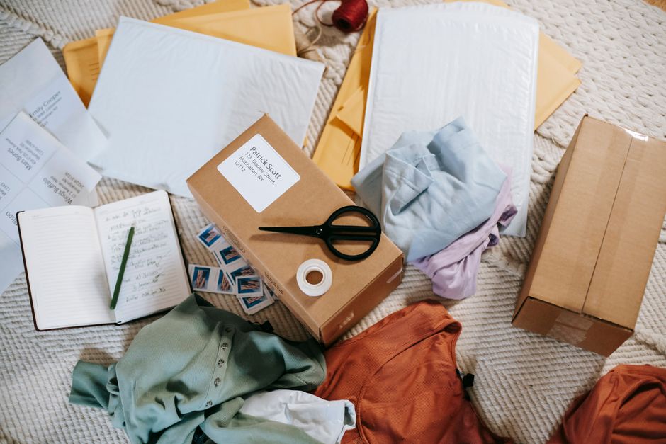 Small business team packing online orders ready for courier collection